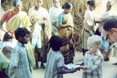 Staines and son Timothy gift a dress to a tribal boy